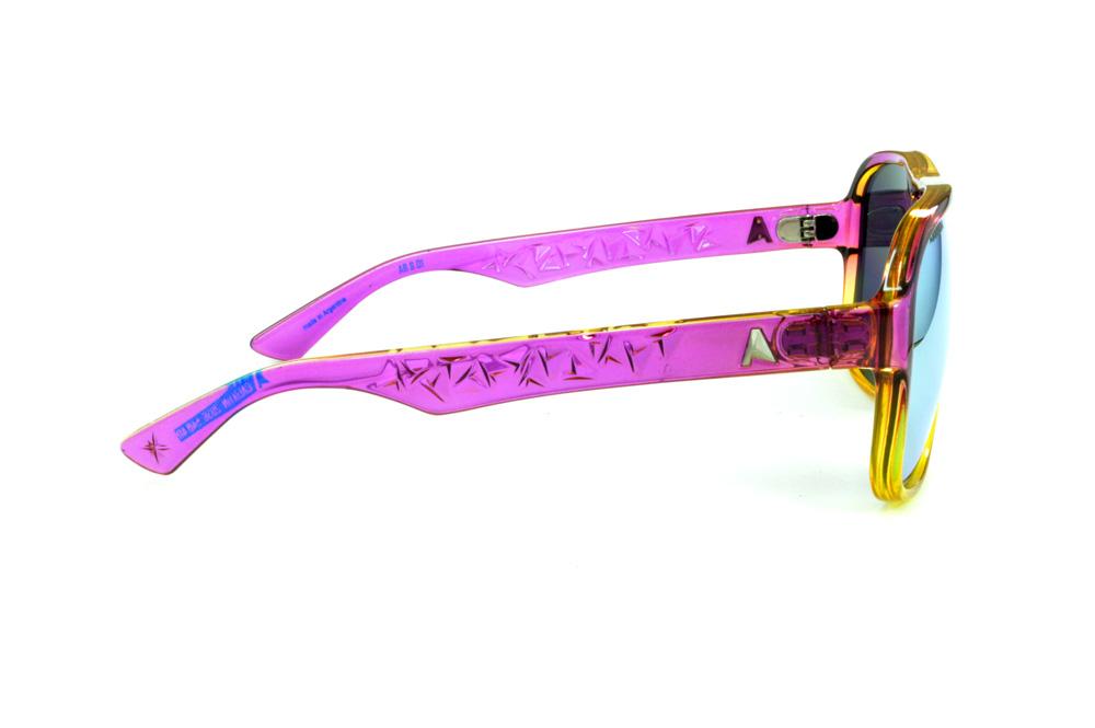 Óculos Absurda Calixtin roxo e amarelo e lente amarela/azul espelhado